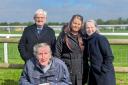 Residents including Richard at Fakenham Racecourse with deputy manager Sarah