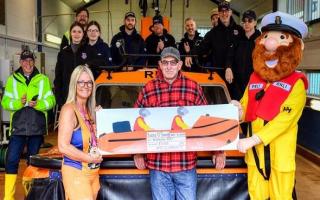 Stacey O'Donnell, front left, with Vic Dade, who piloted the hovercraft with rescued her three daughters, Stormy Stan and the Hunstanton RNLI crewStacey O'Donnell, front left, with Vic Dade, who piloted the hovercraft with rescued her three daughters,