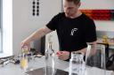 Engineer Chris Bruce demonstrates the unfiltered water (IF/PA)