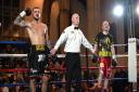 Joe Steed's arm is raised in victory by referee Mark Bates