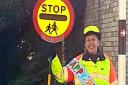 More 'lollipop' men and women are being asked to take on school crossing patrols by Cambridgeshire County Council during Road Safety Week. Pictured is lollipop lady Annette Palmer has retired from her duties after 10 years of service at The Weatheralls