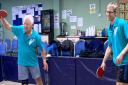 Bob (left) and Mark Littlechild in action during a table tennis event. Picture: PETER MUNCH