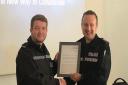 PC Patryk Warmuz (L), a student officer, performed CPR on a man in cardiac arrest after receiving an alert from GoodSAM on his personal phone. He\'s pictured with Sergeant Chris Postill from the Digital Policing Team.