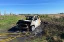 Appeal after car set on fire in the open in March