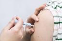 Stock photo of a Covid booster vaccine being administered.