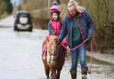 Emily (4) rides Angel the Pony with help from Nanna on Flooded Sutton Gault Road.
Cambridgeshire underwater as river levels continue to rise and Environment Agency issues flood alerts for the area.,
Sutton Gault, Ely
Wednesday 29 December 2021. 
Picture