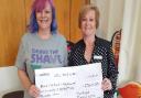 Nikki Jarvis (L) and her Slimming World consultant Tina Rust (R).Tina's Wisbech and Terrington groups have kindly been donating their loose change for Nikki’s ‘Bravetheshave’ to Macmillan Cancer Support.