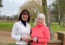 10th anniversary competition winner Petra Meir, left, being presented with her trophy by 2023 ladies captain Sylvia Illsley.