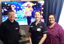 Left to right: David Youngs, manager of the Hughes Electrical store in Wisbech's Horsefair Shopping Centre, Alan Hudson Day Treatment Centre matron Michelle Knight and fundraising manager Toni Bird, with the new TV.