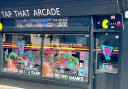 Creative People and Places: MarketPlace artist Cary Outis has transformed the windows of town centre shops with chalk pen dragon drawings ahead of next weekend's St George's Festival. This is his design for Tap That arcade.