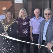 A smiling mayor, Cllr Susan Wallwork, signalling the wait is over for shoppers and bus passengers in Wisbech to use a convenient loo.