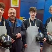 Michael Wills (second from left) has helped other apprentices with welding techniques while at Stainless Metalcraft.
