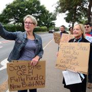 Jo Rust, left, secretary of the King's Lynn Trades Council, takes a selfie at a protest outside the Queen Elizabeth Hospital with its outgoing chief executive, Caroline Shaw