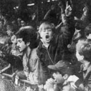 Supporters in the Lerowe Road end shelter celebrating Wisbech'’s first goal against Collier Row in an FA Vase quarter-final.