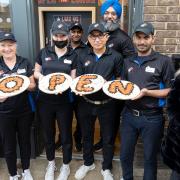 Deborah Slator (far right) with the team from the new Domino's store which has opened in Whittlesey.
