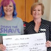 Nikki Jarvis (L) and her Slimming World consultant Tina Rust (R).Tina's Wisbech and Terrington groups have kindly been donating their loose change for Nikki’s ‘Bravetheshave’ to Macmillan Cancer Support.
