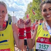 Kerry Bullen and Troi Baxter with their medals after setting a new Guinness World Record at the London Marathon.