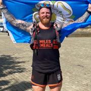John Clark, a former strongman champion, is tackling 48 marathons in 48 counties over 48 days, including Cambridgeshire.