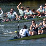Cambridge University celebrate winning the 75th Women's Boat Race on the River Great Ouse at Littleport.