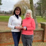 10th anniversary competition winner Petra Meir, left, being presented with her trophy by 2023 ladies captain Sylvia Illsley.