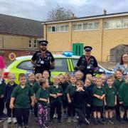 Cambridgeshire police with pupils at Upwell Academy
