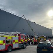 More than 50 firefighters have been at the scene of a roof fire at a commercial building in the Alwalton area of Peterborough this afternoon.
