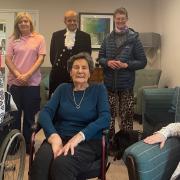 The High Sheriff of Cambridgeshire Dr Bharatkumar Khetani with residents and staff at Rose Lodge Care Home in Wisbech.