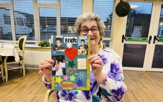 Resident, Betty, showcasing her Elvis scrapbook masterpiece she created in craft club, in honour of the King of rock and roll on his birthday.